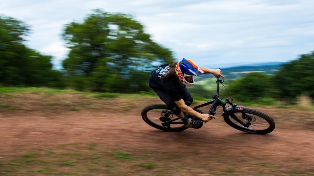Mountain biker riding round a berm