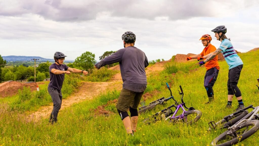 DW coach teaching a range of students about posture on the bike