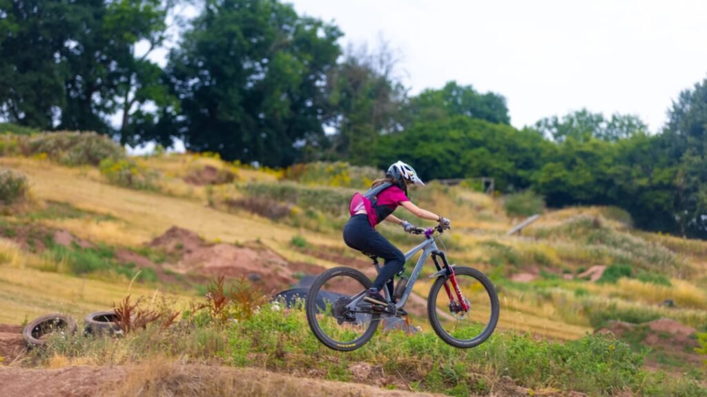 Person in the air on their mountain bike